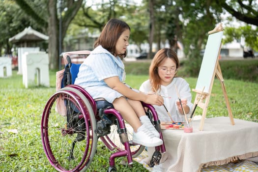 Two close friends, one in a wheelchair, drawing together outdoors in a park, showcasing creativity, inclusion, and friendship.