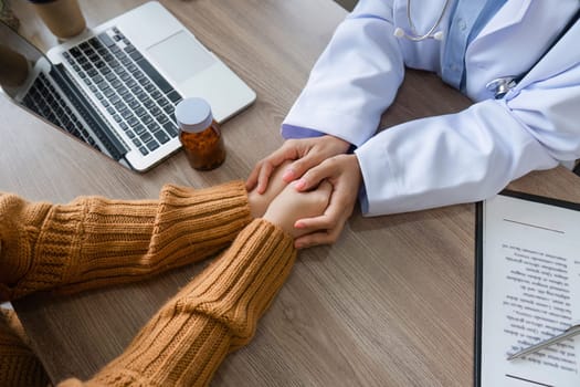 A female doctor offers expert health advice to a patient in a modern medical office, emphasizing care and professionalism.