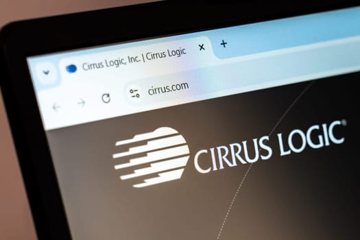 New York, USA - December 21, 2024: Cirrus Logic website homepage displayed on laptop screen with logo. Semiconductor company specializing in audio and voice signal processing solutions