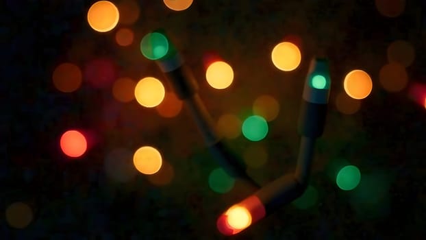 Glowing Christmas lights gently shift colors in a seamless loop, their soft flickers creating a warm and inviting holiday ambiance on a blurred background.