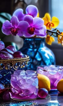 Stunning purple orchid with ice-filled glass, lemon, and vibrant spheres. Fresh and colorful composition ideal for floral, beverage, or wellness sectors