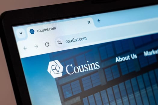 New York, USA - December 21, 2024: Cousins website homepage displayed on laptop screen with logo. Real estate investment company specializing in commercial properties