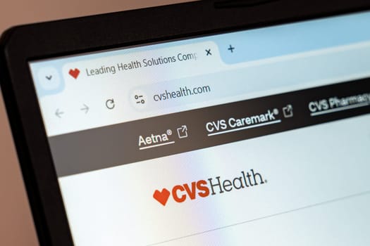 New York, USA - December 21, 2024: CVS Health website homepage displayed on laptop screen with logo. Healthcare company offering pharmacy services, insurance, and wellness products