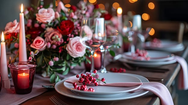 Festive table setting with candles and arrangement of beautiful red flowers. Holiday concept. High quality photo