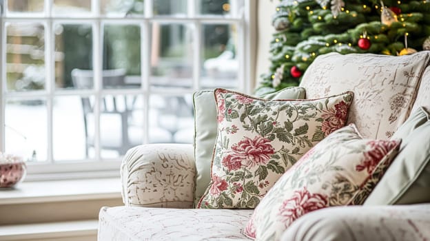 Colorful pillows on sofa against glass wall of window in a winter garden or conservatory. Interior textile concept. High quality photo