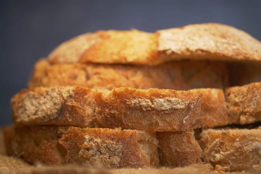 A closeup of freshly sliced whole grain bread, showcasing its unique texture and freshness