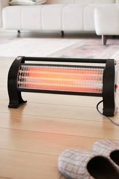 Modern electric infrared heater in living room, closeup. High quality photo