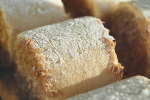 Enjoy irresistible pastries dusted with powdered sugar, perfect for dessert lovers