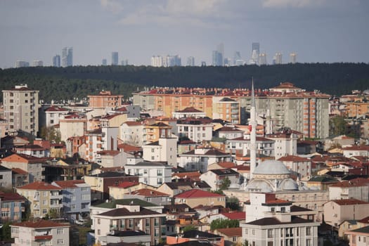 A picturesque scenic view showcasing residential buildings with a stunning city skyline backdrop