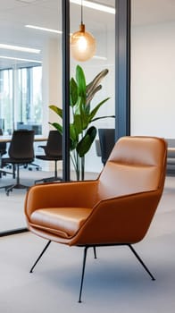 A stylish leather armchair is placed in a contemporary office setting. The room features glass walls, a potted plant, and ample natural light, creating a professional and inviting atmosphere