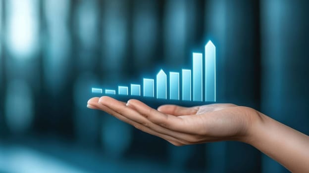 A digital bar graph hologram floats above a hand, representing business growth and data analysis. The image conveys innovation, technology, and futuristic concepts in a business context