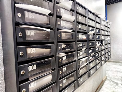 Kazan, Russia - August 02, 2024: Multiple rows of mailboxes are arranged orderly in a contemporary postal setting, allowing for efficient mail retrieval.