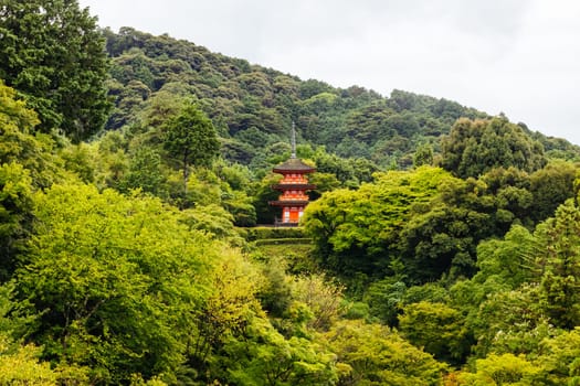 The iconic Kiyomizu-dera temple and mountain view on a sunny spring day in Kyoto, Japan