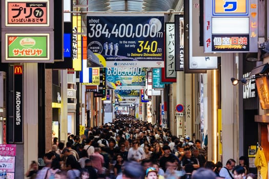 OSAKA, JAPAN - SEPTEMBER 24 2024: The view inside of the long covered and crowded shopping street, Shin Sai Bashi Suji in Dotonbori, Osaka, Japan