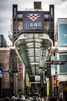 OSAKA, JAPAN - SEPTEMBER 24 2024: The view inside of the long covered and crowded shopping street, Shin Sai Bashi Suji in Dotonbori, Osaka, Japan