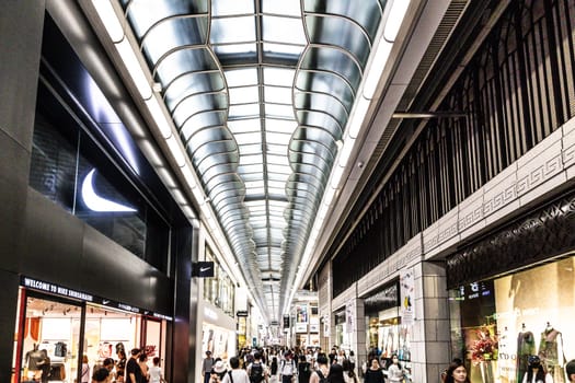 OSAKA, JAPAN - SEPTEMBER 25 2024: The view inside of the long covered and crowded shopping street, Shin Sai Bashi Suji in Dotonbori, Osaka, Japan