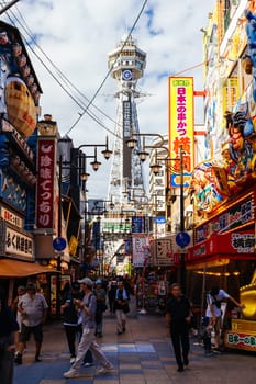 OSAKA, JAPAN - SEPTEMBER 26 2024: The famous Shinsekai area with Tsutenkaku Tower on a clear autumn day in Osaka, Japan
