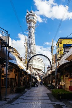OSAKA, JAPAN - SEPTEMBER 26 2024: The famous Shinsekai area with Tsutenkaku Tower on a clear autumn day in Osaka, Japan