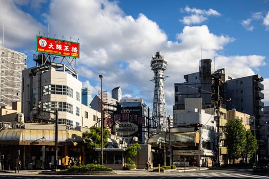 OSAKA, JAPAN - SEPTEMBER 26 2024: The famous Shinsekai area with Tsutenkaku Tower on a clear autumn day in Osaka, Japan