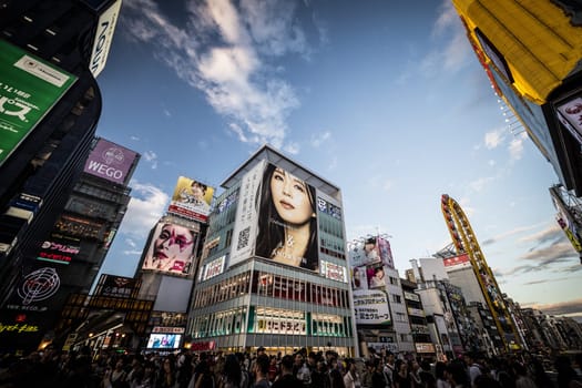 OSAKA, JAPAN - SEPTEMBER 26 2024: The view down Dotonbori River from Ebisubashi Bridge on a clear autumn day in Osaka, Japan