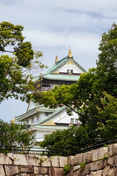 OSAKA, JAPAN - SEPTEMBER 25 2024: The iconic Osaka Castle and lush surrounds on a warm clear autumn day in Osaka, Japan on September 25th 2024