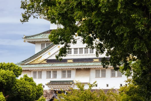 OSAKA, JAPAN - SEPTEMBER 25 2024: The iconic Osaka Castle and lush surrounds on a warm clear autumn day in Osaka, Japan on September 25th 2024