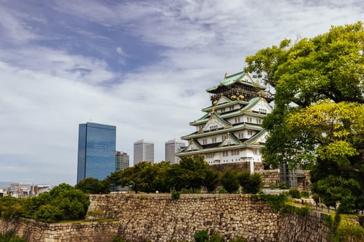OSAKA, JAPAN - SEPTEMBER 25 2024: The iconic Osaka Castle and lush surrounds on a warm clear autumn day in Osaka, Japan on September 25th 2024