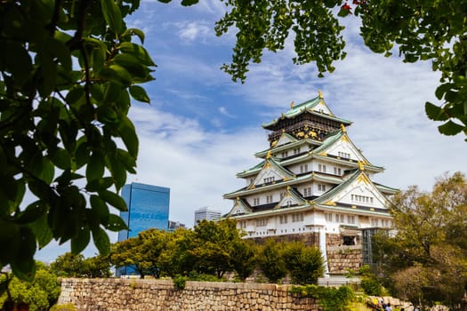 OSAKA, JAPAN - SEPTEMBER 25 2024: The iconic Osaka Castle and lush surrounds on a warm clear autumn day in Osaka, Japan on September 25th 2024