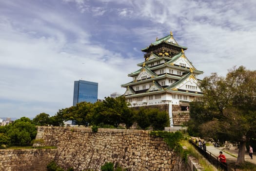 OSAKA, JAPAN - SEPTEMBER 25 2024: The iconic Osaka Castle and lush surrounds on a warm clear autumn day in Osaka, Japan on September 25th 2024