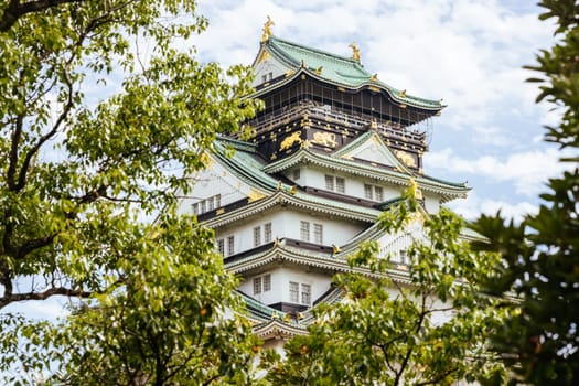 OSAKA, JAPAN - SEPTEMBER 25 2024: The iconic Osaka Castle and lush surrounds on a warm clear autumn day in Osaka, Japan on September 25th 2024