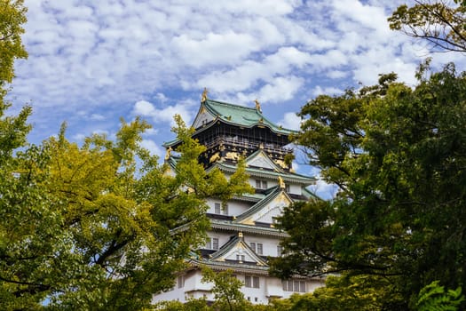 OSAKA, JAPAN - SEPTEMBER 25 2024: The iconic Osaka Castle and lush surrounds on a warm clear autumn day in Osaka, Japan on September 25th 2024