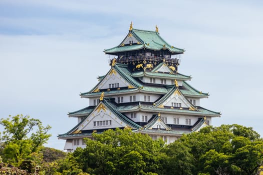 OSAKA, JAPAN - SEPTEMBER 25 2024: The iconic Osaka Castle and lush surrounds on a warm clear autumn day in Osaka, Japan on September 25th 2024