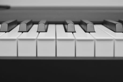 Close up of piano white black keys