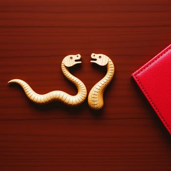 two wooden snakes chinese new year holiday money love. High quality photo