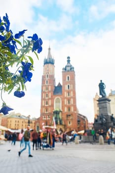 An ancient church of St. Mary with two towers on the central square of the European city of Krakow