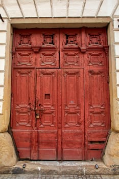 An ancient majestic door in a European city