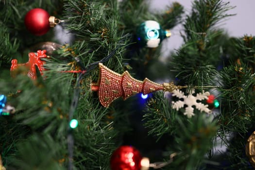 A beautifully adorned Christmas tree, showcasing a variety of vibrant ornaments and twinkling lights that sparkle