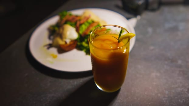 Gourmet meal with a refreshing drink on a dark table, elegant dining concept at the cafe
