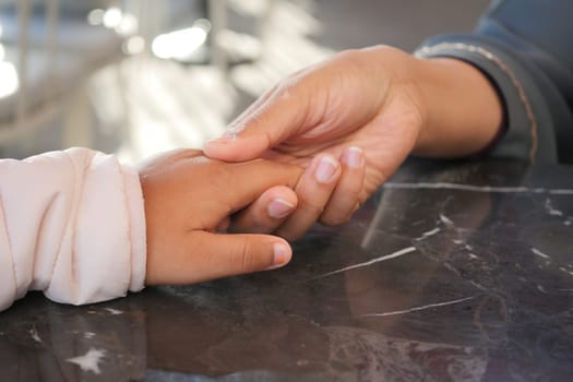 A touching moment between a joyful child and a caring adult, highlighting their special bond