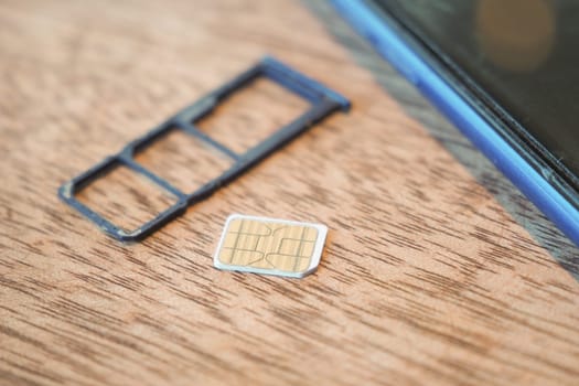 A sim card for a smart phone on table .
