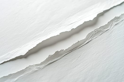 High-resolution close-up of a tear diagonally running across a white sheet of paper. the fibers are vividly visible along the ripped edges, creating a striking textured effect. ideal for design projects emphasizing authenticity and detail.