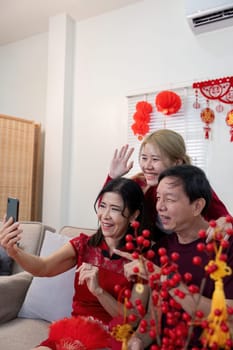 A joyful family captures special moments during Chinese New Year celebrations highlighting love and togetherness.