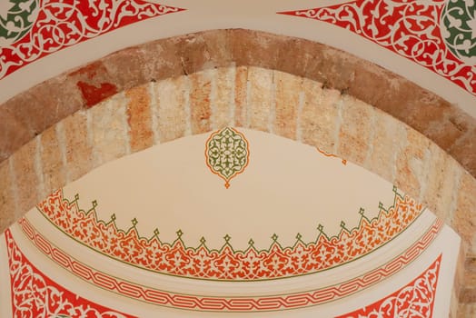 The detailed Moroccan archway features vivid colors and intricate patterns that captivate