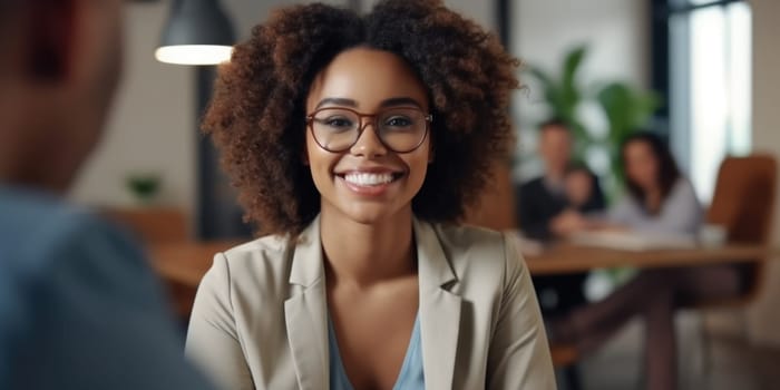 Stylish confident adult 30 years old african american female psychologist sitting arms crossed looking at camera. AI Generated