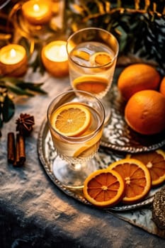 High angle of christmas table with glass of cocktail with champagne, blurred christmas tree on background. AI Generated