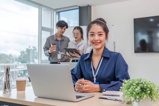 Business people meeting using laptop computer,calculator,notebook,stock market chart paper for analysis Plans to improve quality next month. Conference Discussion Corporate Concept.