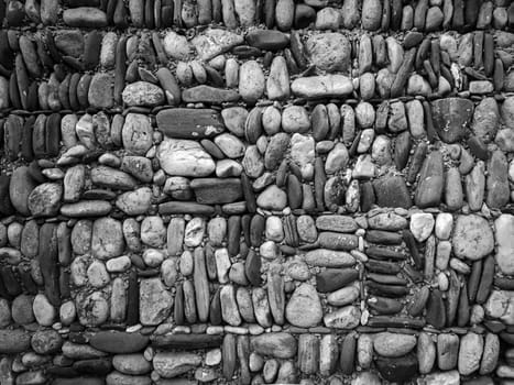 Rock and stone wall texture at the beach with Old brick stone wall background, High quality photo