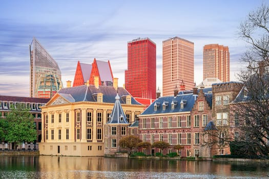 The Hague, Ridderzaal in Binnenhof with the Hofvijver lake at sunset. Meeting place of States General of the Netherlands, the Ministry. Office of the Prime Minister of Netherlands.