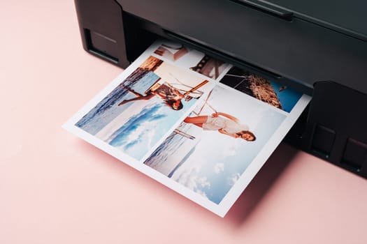 Modern laser printer printing color photos of women close up on desk