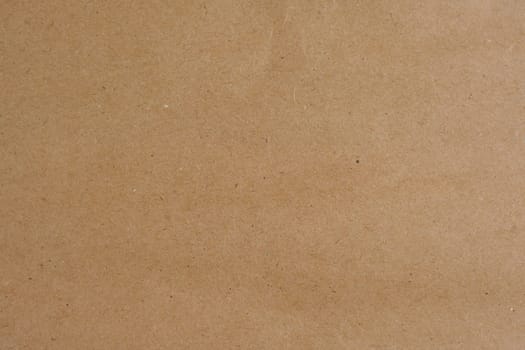 Blank kraft paper background with natural texture, ideal for use in design, crafting, or as a rustic and simple backdrop, no people.